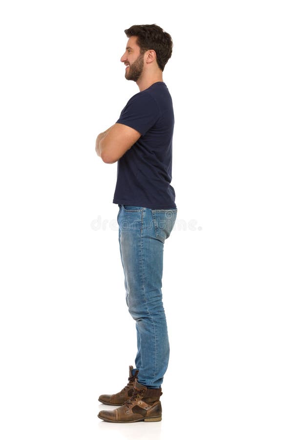 Side view of a young casual man standing isolated on white background Stock  Photo | Adobe Stock