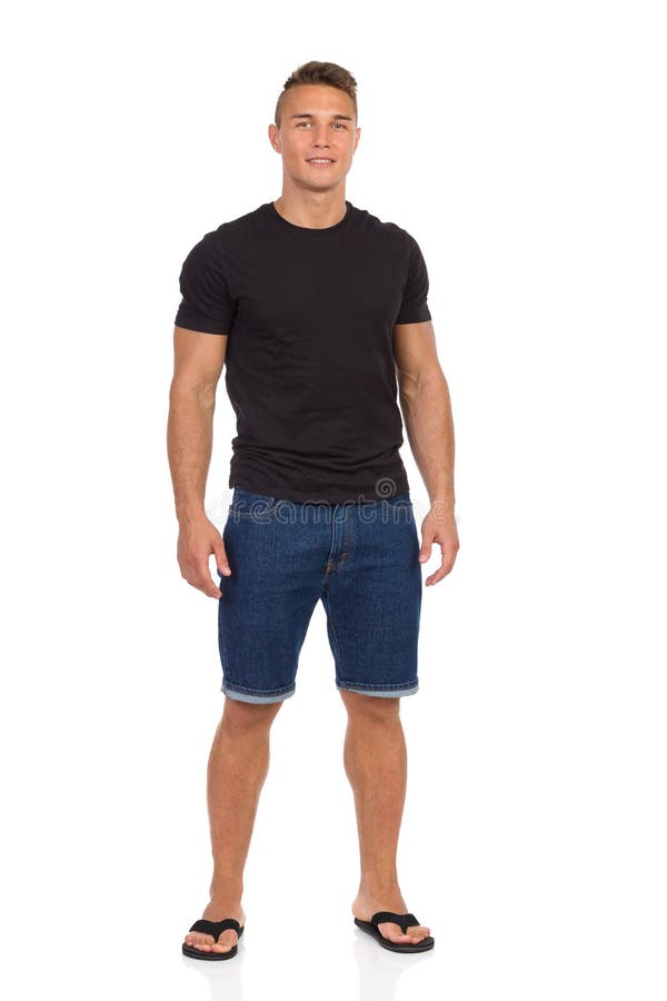 Download Young Man In Jeans Shorts, Black T-Shirt And Sandals Stock ...