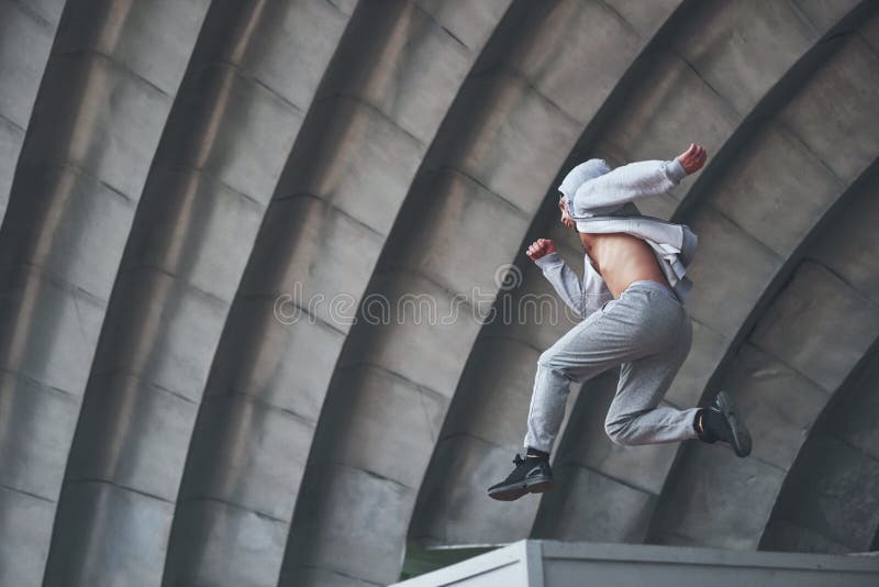 pix Jumping Dynamic Parkour Poses parkour on urban building rooftop stock