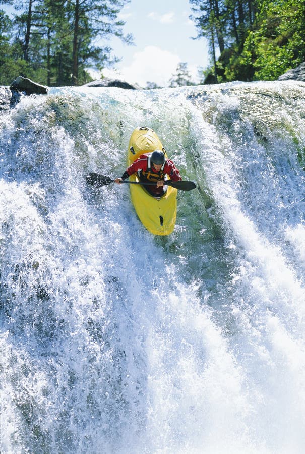 Young Man Kayaking Down Waterfall Stock Image Image of nature, falls