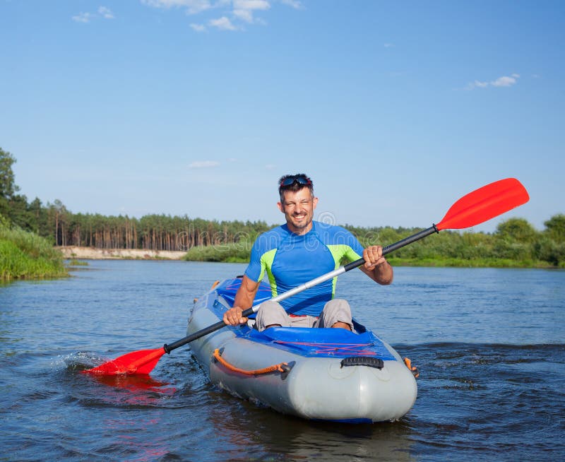 Summer vacation - Young man kayaking on the river. Adventurer adventure stock images, royalty-free photos and pictures