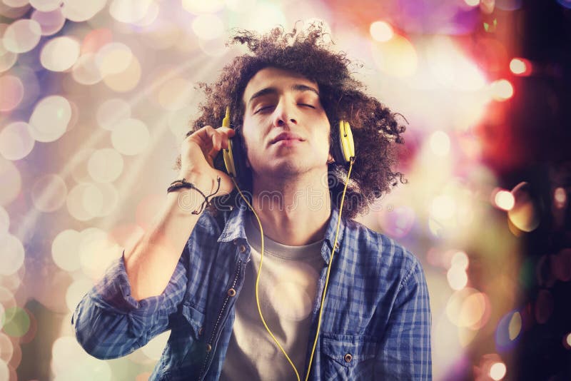 Young man listening music with headphones