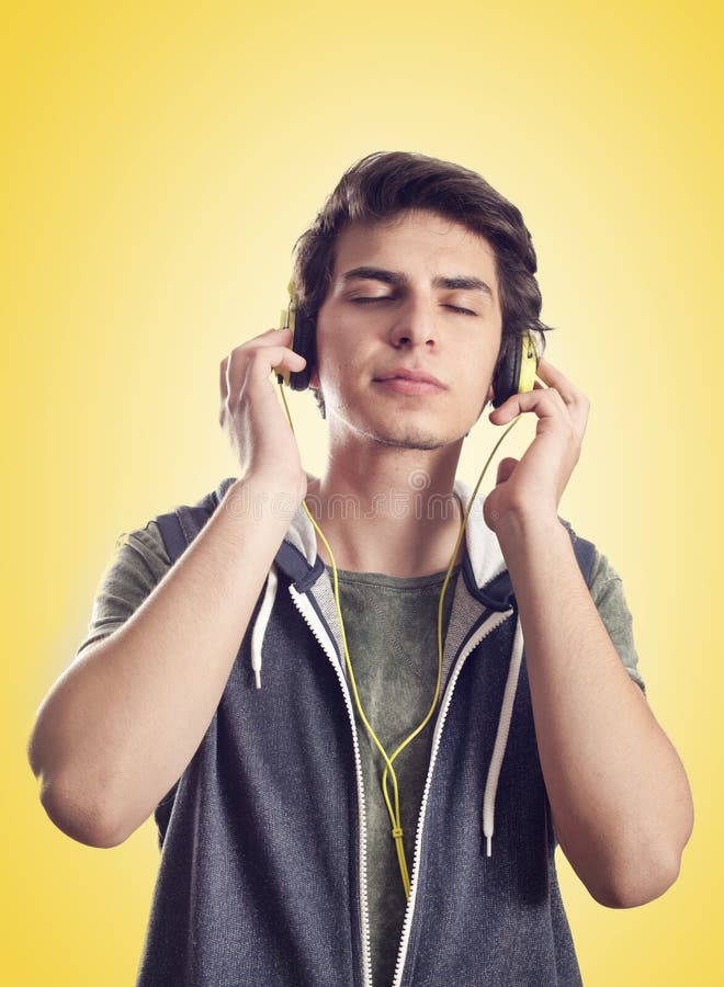 Young man listening music with headphones