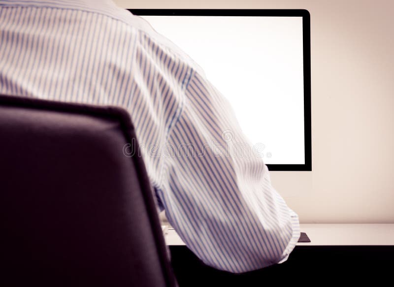 Young man looking at empty computer screen stock images