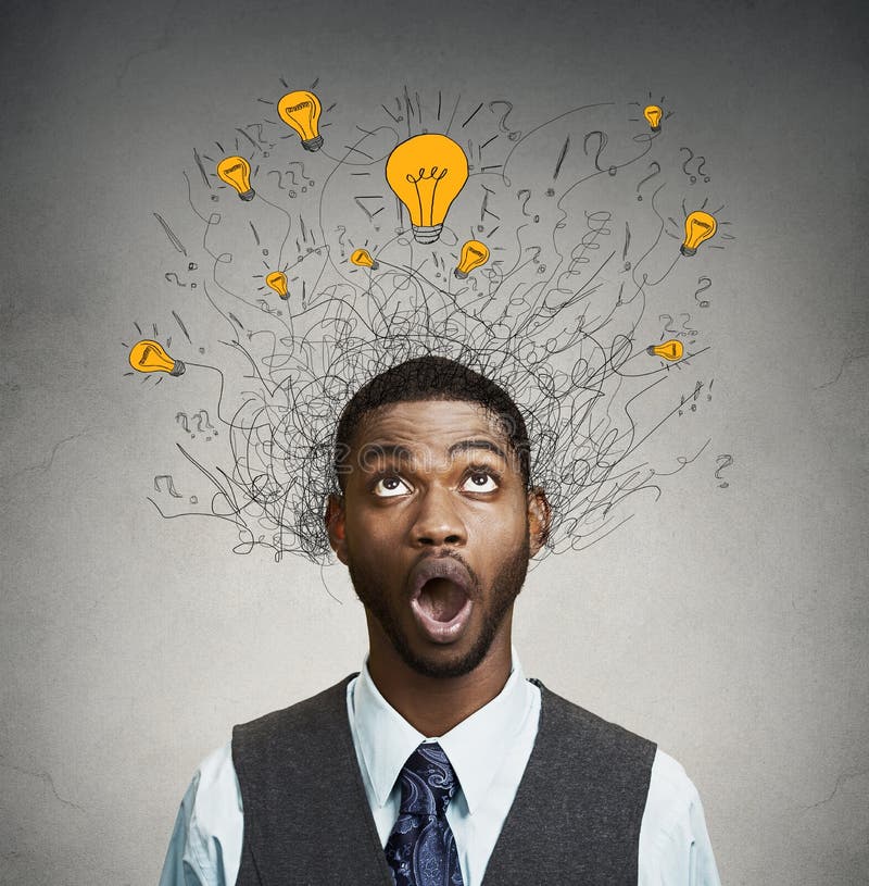 Young man with many idea light bulbs above head looking up