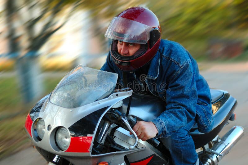 Young man on motorcycle (motorbike).