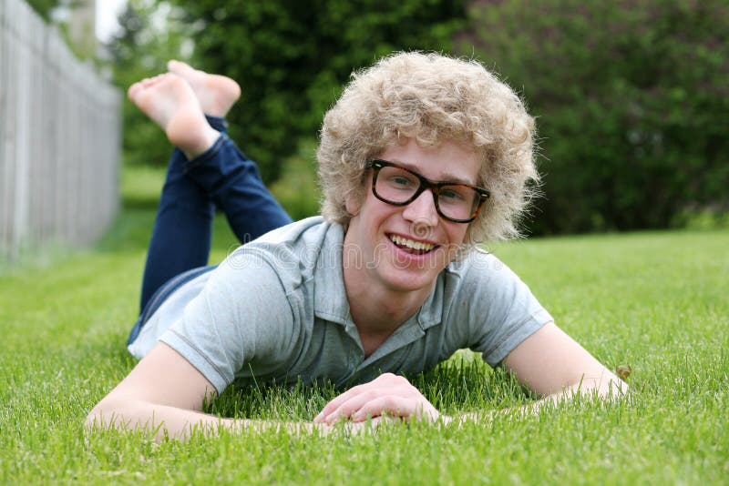 Blonde teen boy with oversize glasses and crazy blond hair. Blonde teen boy with oversize glasses and crazy blond hair