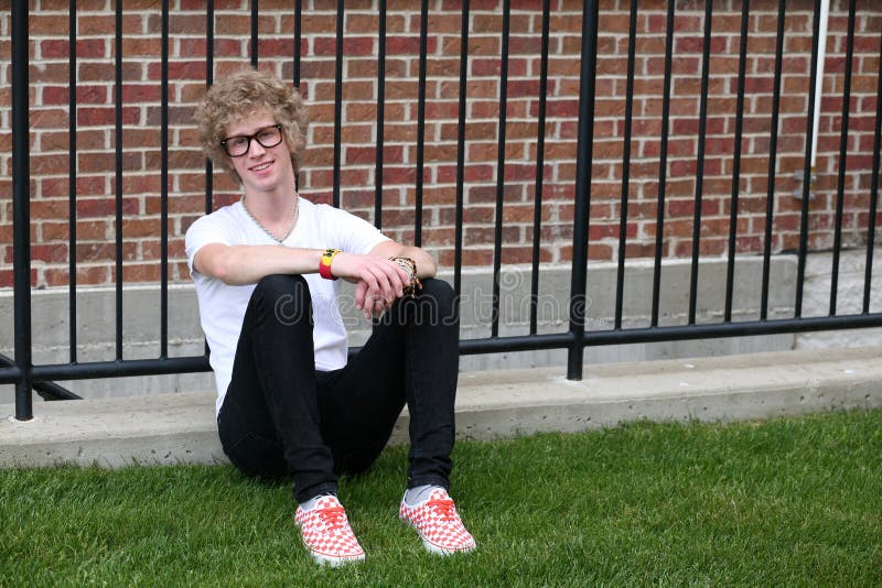 Blonde teen boy with crazy hair and shoes. Blonde teen boy with crazy hair and shoes