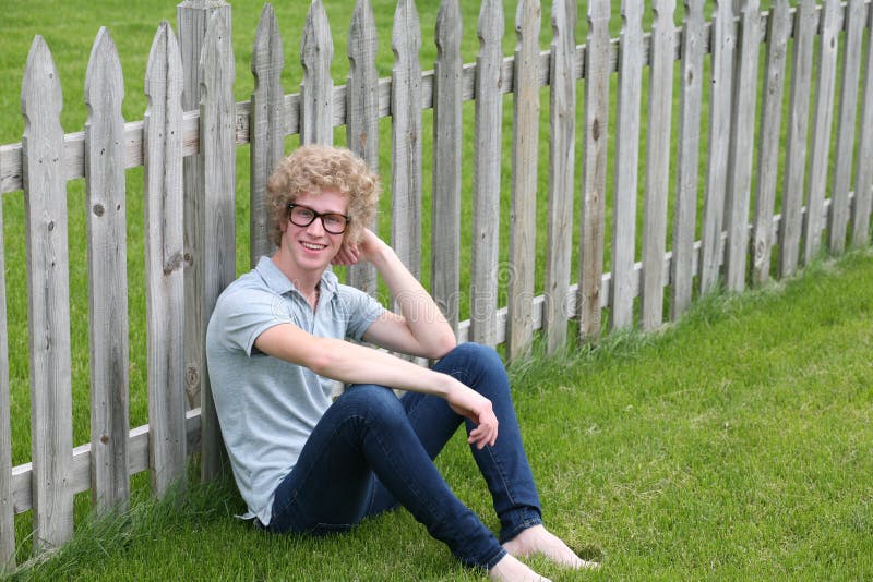 Blonde teen boy with oversize glasses and crazy blond hair. Blonde teen boy with oversize glasses and crazy blond hair