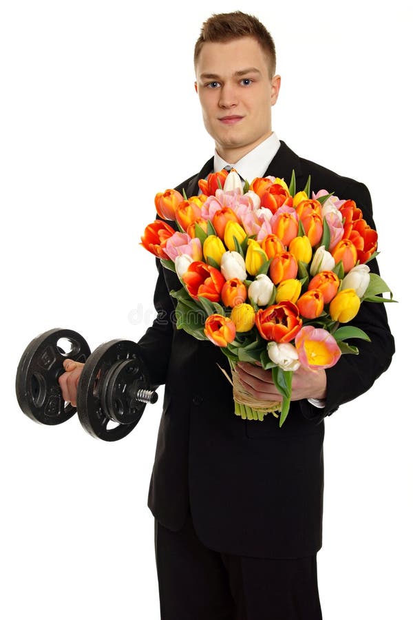 Young man offers tulips