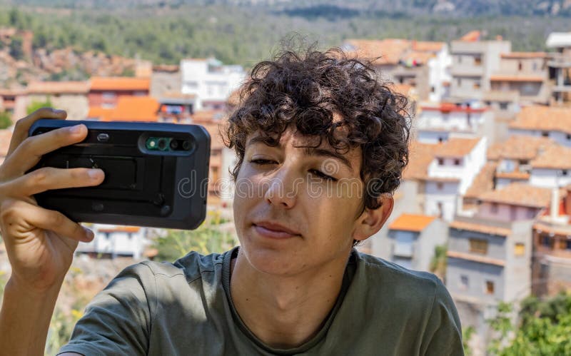 Young man photographing a town royalty free stock image