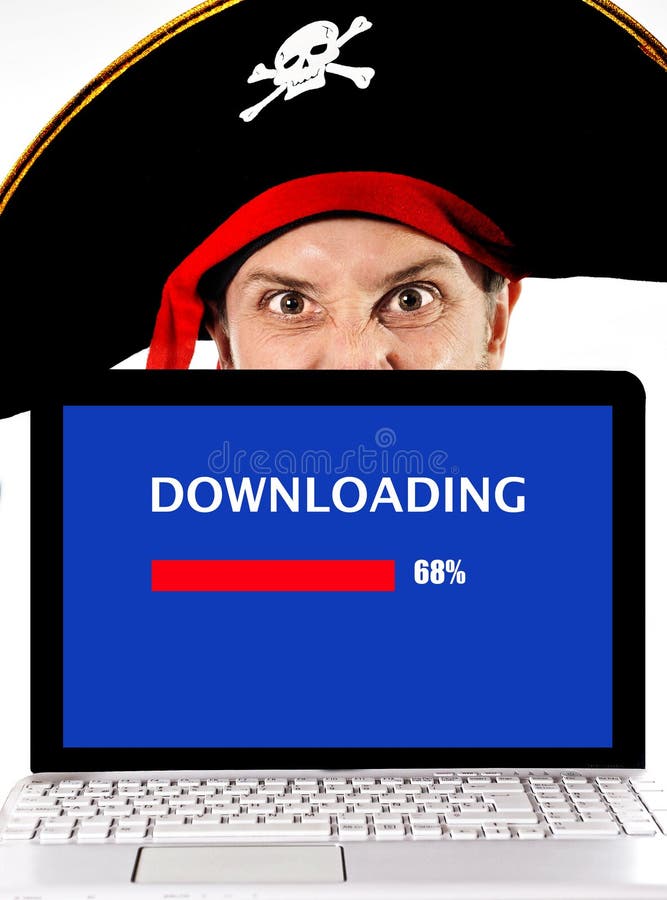 Young man in pirate costume with Computer laptop downloading files copyright violation