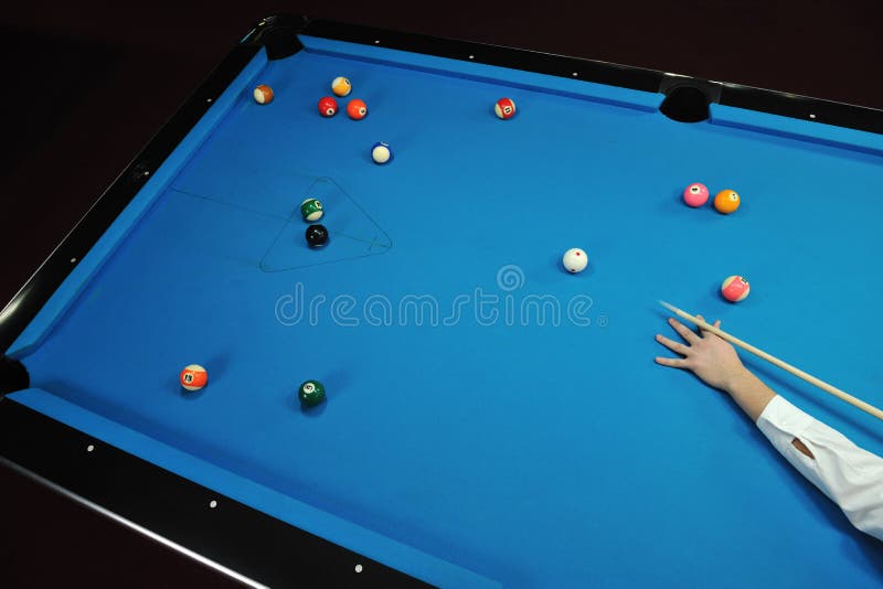 Young man play pro billiard game