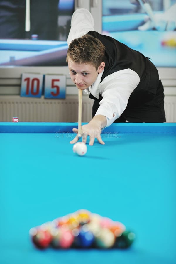 Young man play pro billiard game