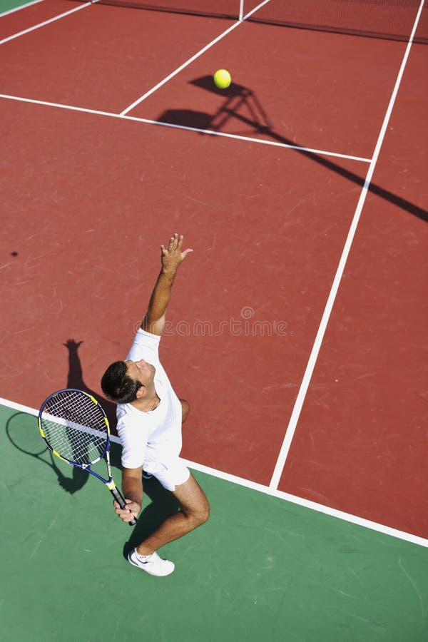 Young man play tennis outdoor