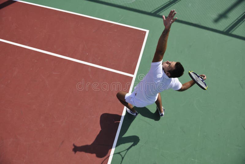 Young man play tennis outdoor