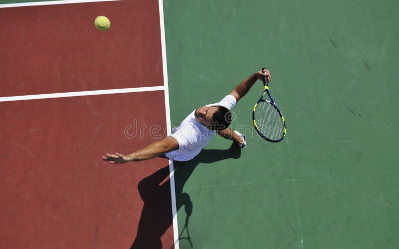 Young man play tennis outdoor