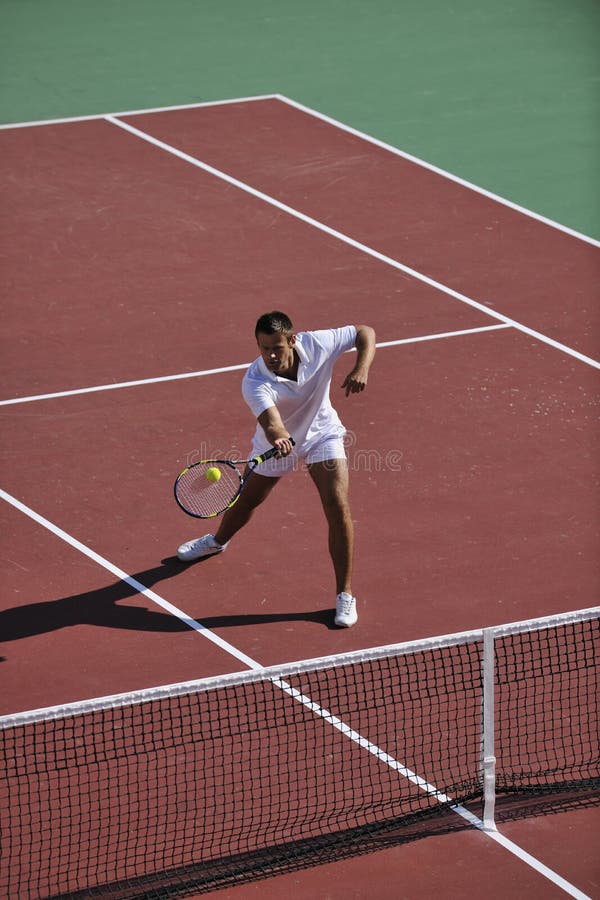 Young man play tennis outdoor