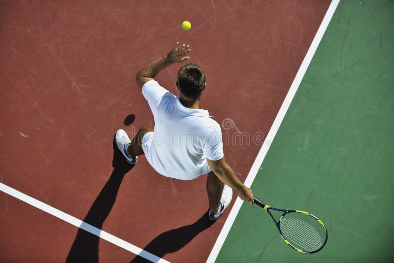 Young man play tennis outdoor