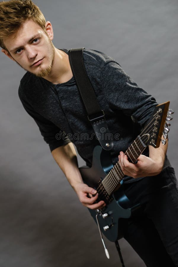 Young Man Playing Electric Guitar Stock Photo - Image of ...