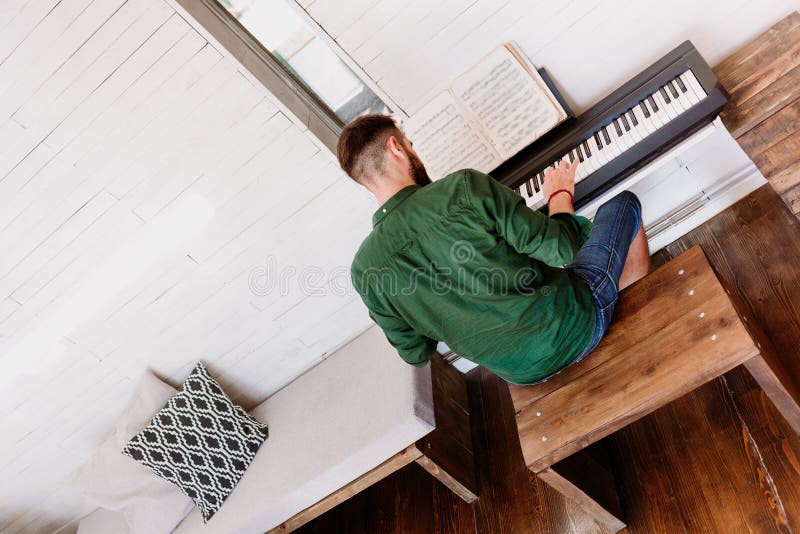 Young Man Playing Electric Piano at Home Stock Photo Image of electric, hands 139327012