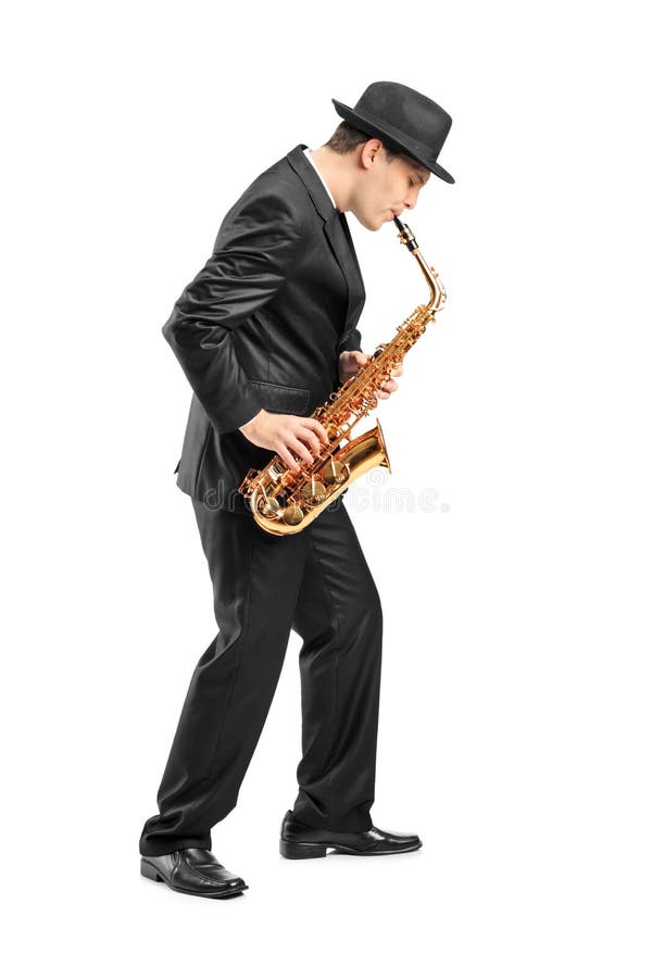 Young man playing on saxophone stock images