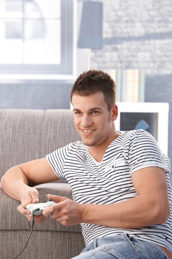 Young man playing video game at home royalty free stock image Young man playing video game at home royalty free stock image