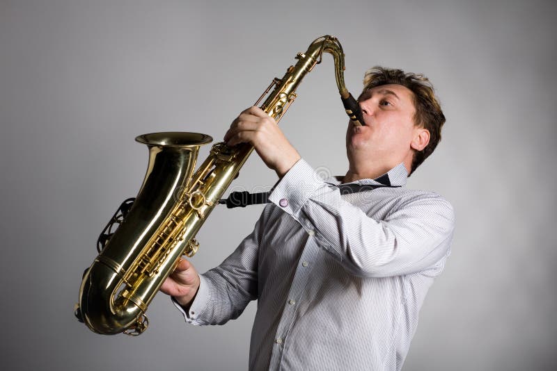 Young Man Plays Sax stock image. Image of person, real 92774249