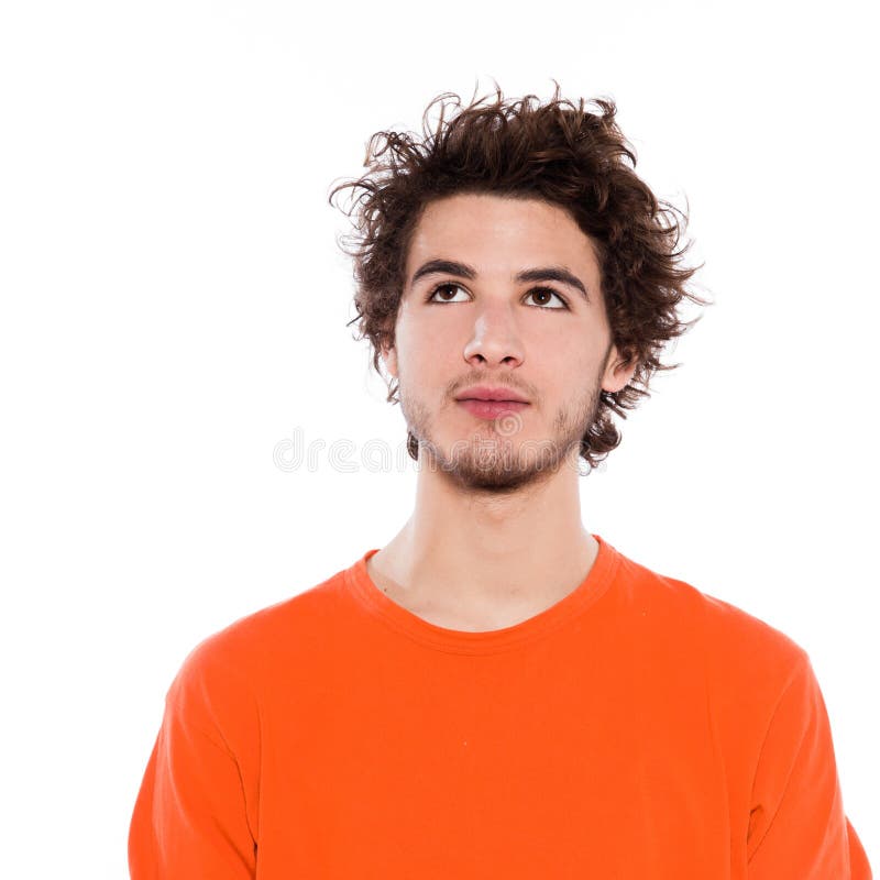 Young man portrait serious looking up