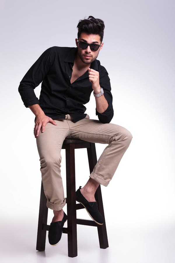 Young Man Posing on a High Chair Stock Photo - Image of attractive ...