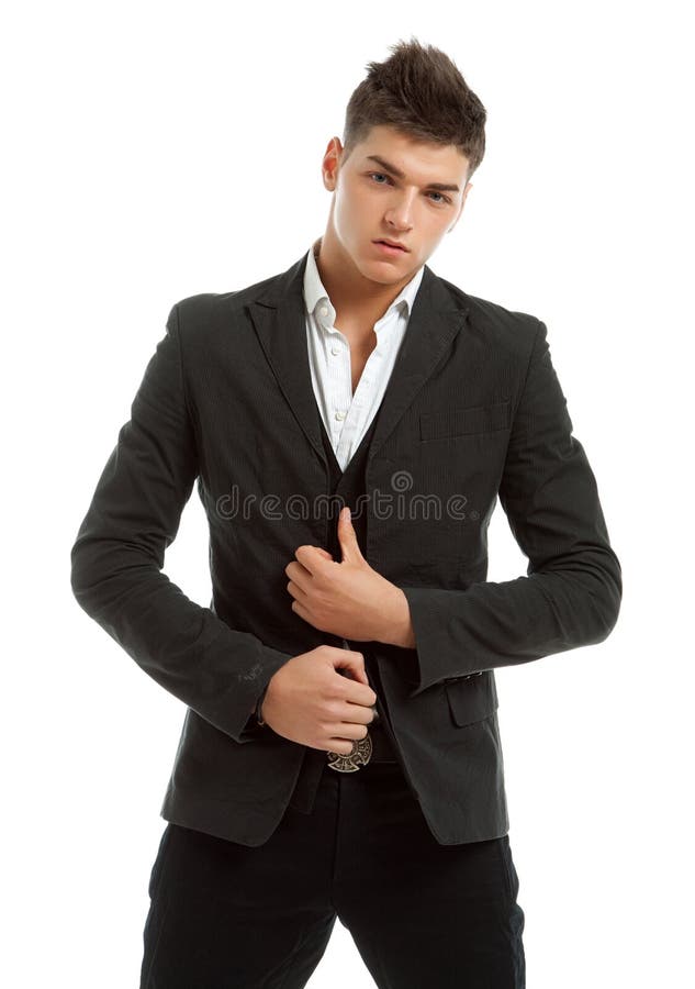 Young man posing in studio dressed in a suit stock photography