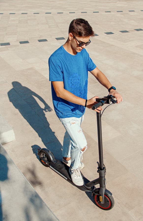 Young Man Powering on an Electric Scooter Stock Photo Image of smart