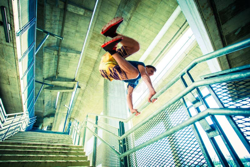 Young man practice parkour jump in the city royalty free stock photography Young man practice parkour jump in the city royalty free stock photography