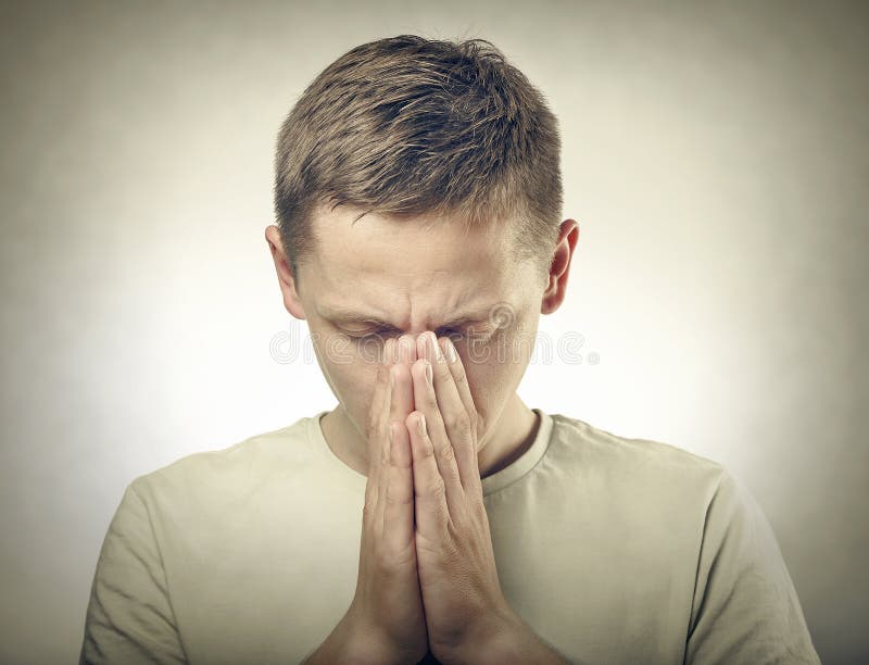 Man Praying with His Head Down Outside in Nature. Stock Image Image