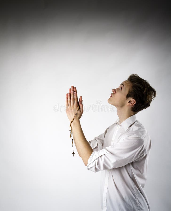 Young Man is Praying with Rosary Beads Stock Photo - Image of beads