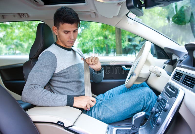 Young Man Putting Safe Belt on in Car Stock Photo Image of long