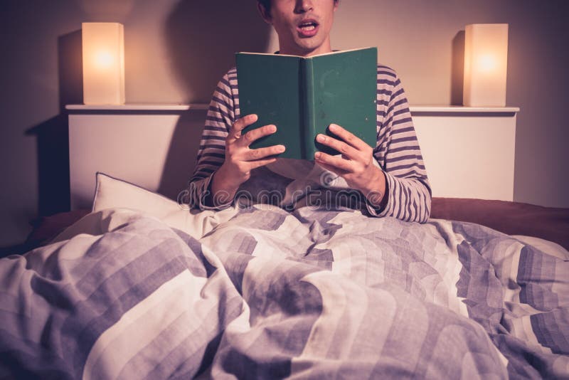Young Man Reading in Bed Asleep Stock Photo Image of horizontal, book 32979854