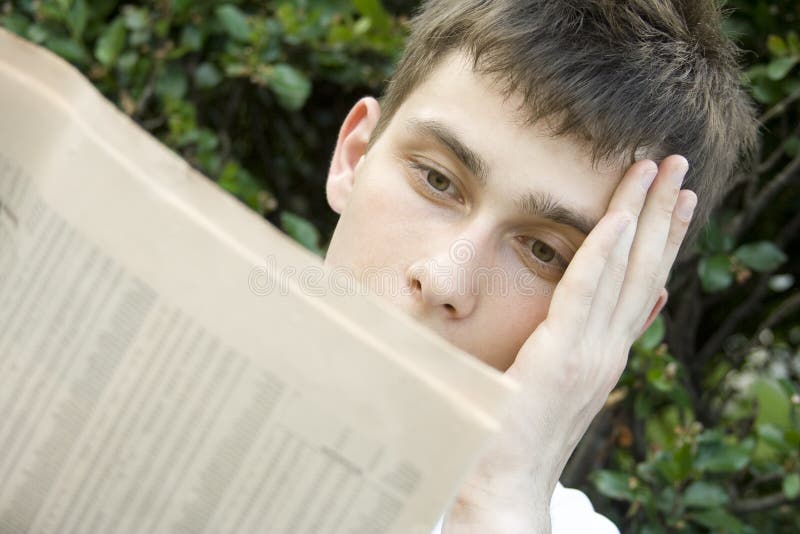 Young man Reading Newspaper