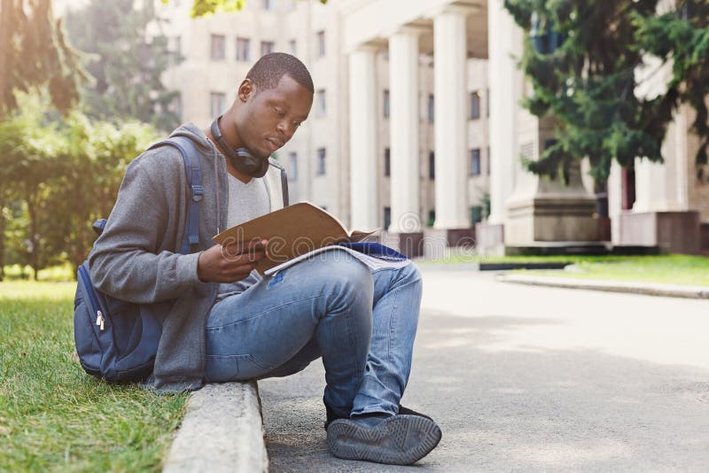 Young man reading notes at university copy space royalty free stock images Young man reading notes at university copy space royalty free stock images