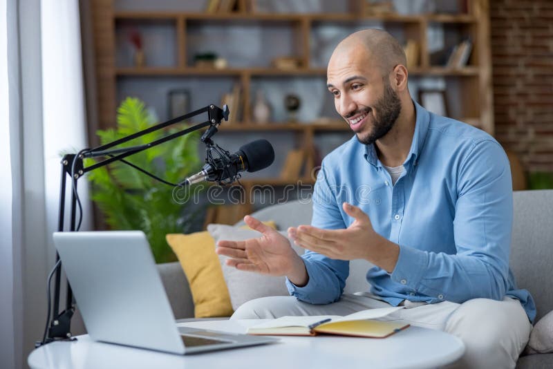 Young man recording podcast at home studio live streaming royalty free stock photography