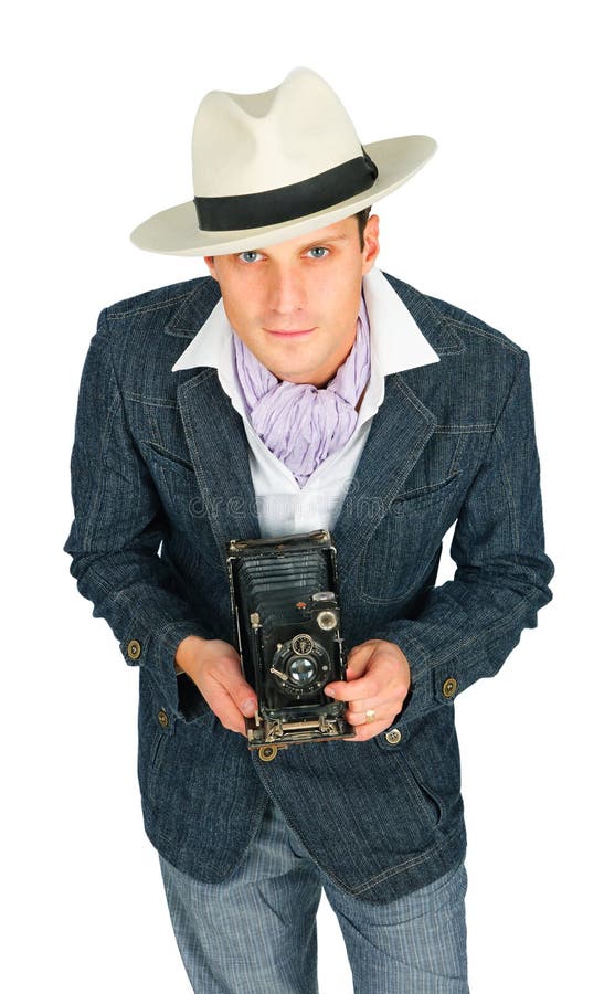 Young man in a retro style with a camera