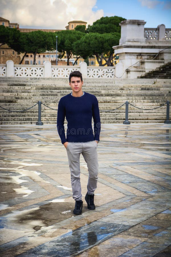 Young man in Rome in front of Vittoriano monument