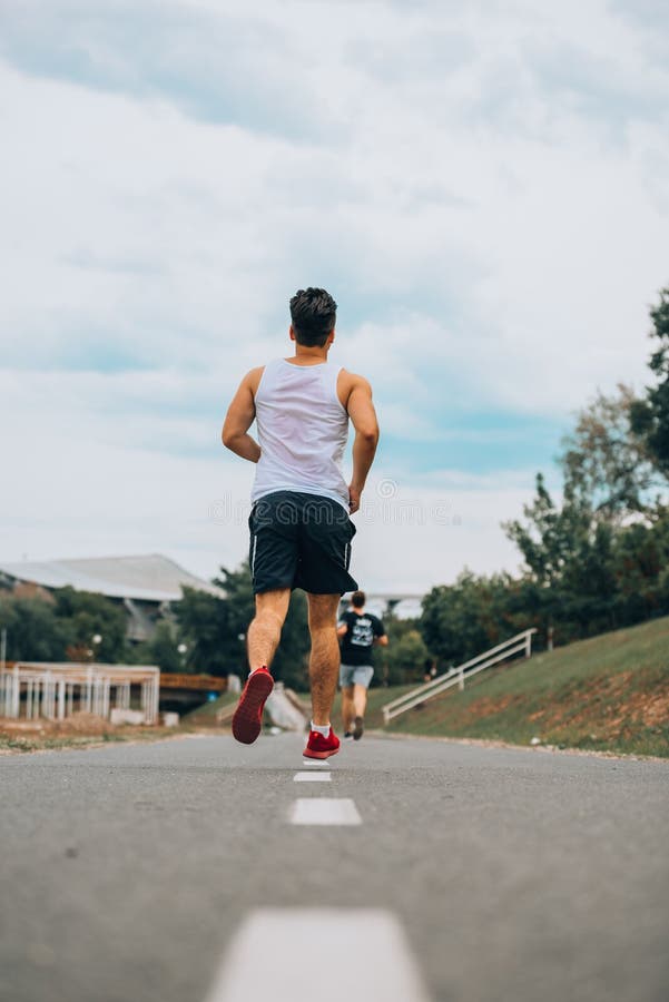 Athletic Sport Runner Man Running In Urban Training Stock Photo