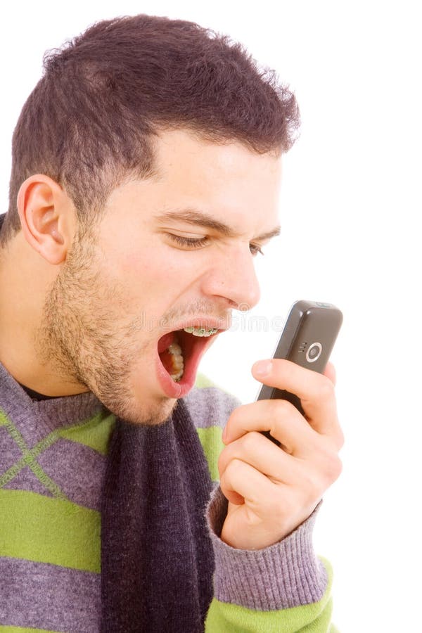 Young man scream to the phone royalty free stock photo Young man scream to the phone royalty free stock photo