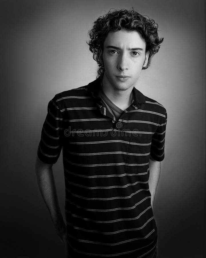 Closeup portrait of a young man with serious face.