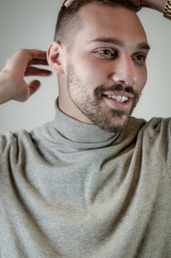 Young Man with a Short Beard Looks Embarrassed in Conversation and Touches His Hair Stock Photo - Image of explaining, face: 210900590 Young Man with a Short Beard Looks Embarrassed in Conversation and Touches His Hair Stock Photo - Image of explaining, face: 210900590