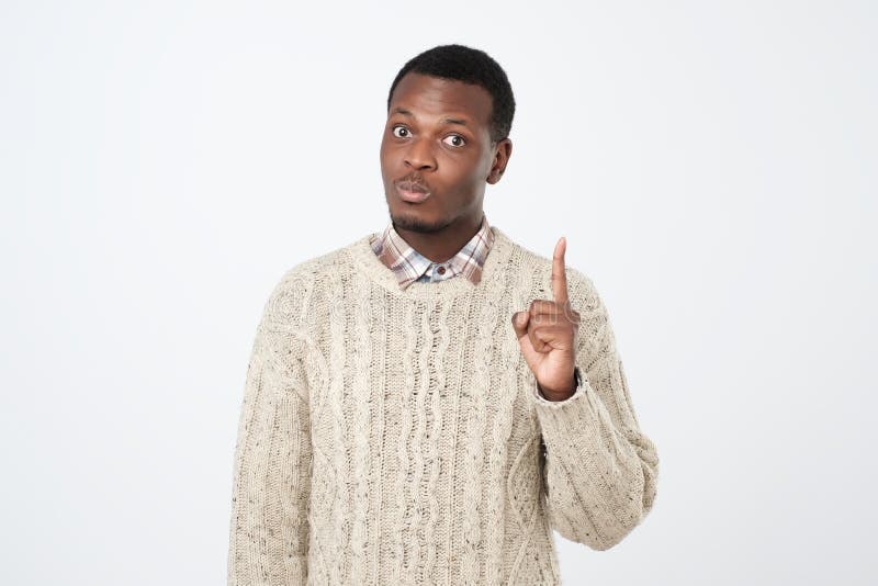 young man showing index fingers up, giving advice or recommendation royalty free stock photography young man showing index fingers up, giving advice or recommendation royalty free stock photography