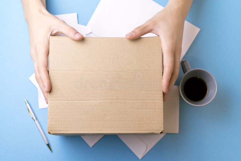 The young man signs the letters and parcels. The concept of service delivery, the post office. royalty free stock photography The young man signs the letters and parcels. The concept of service delivery, the post office. royalty free stock photography