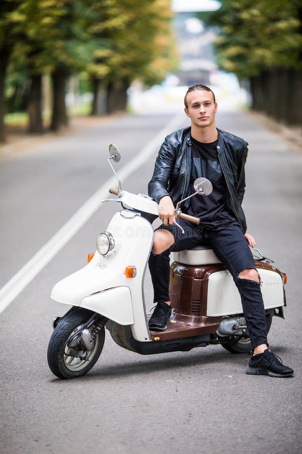 Young Man Siiting On Scooter Street City Stock Photo - Image of