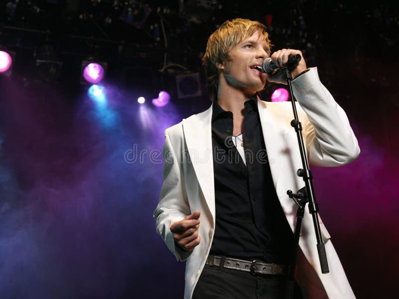 Young Man Singing Into Microphone